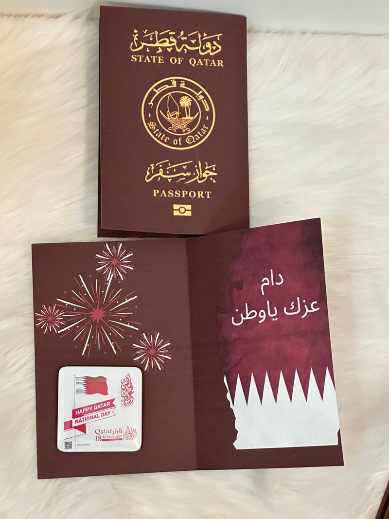 Qatar National Day distributions, Qatar newspaper-shaped card, Qatar gifts.